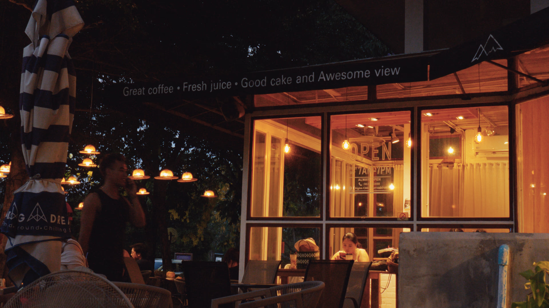 A glass cafe at dusk, through Driffield